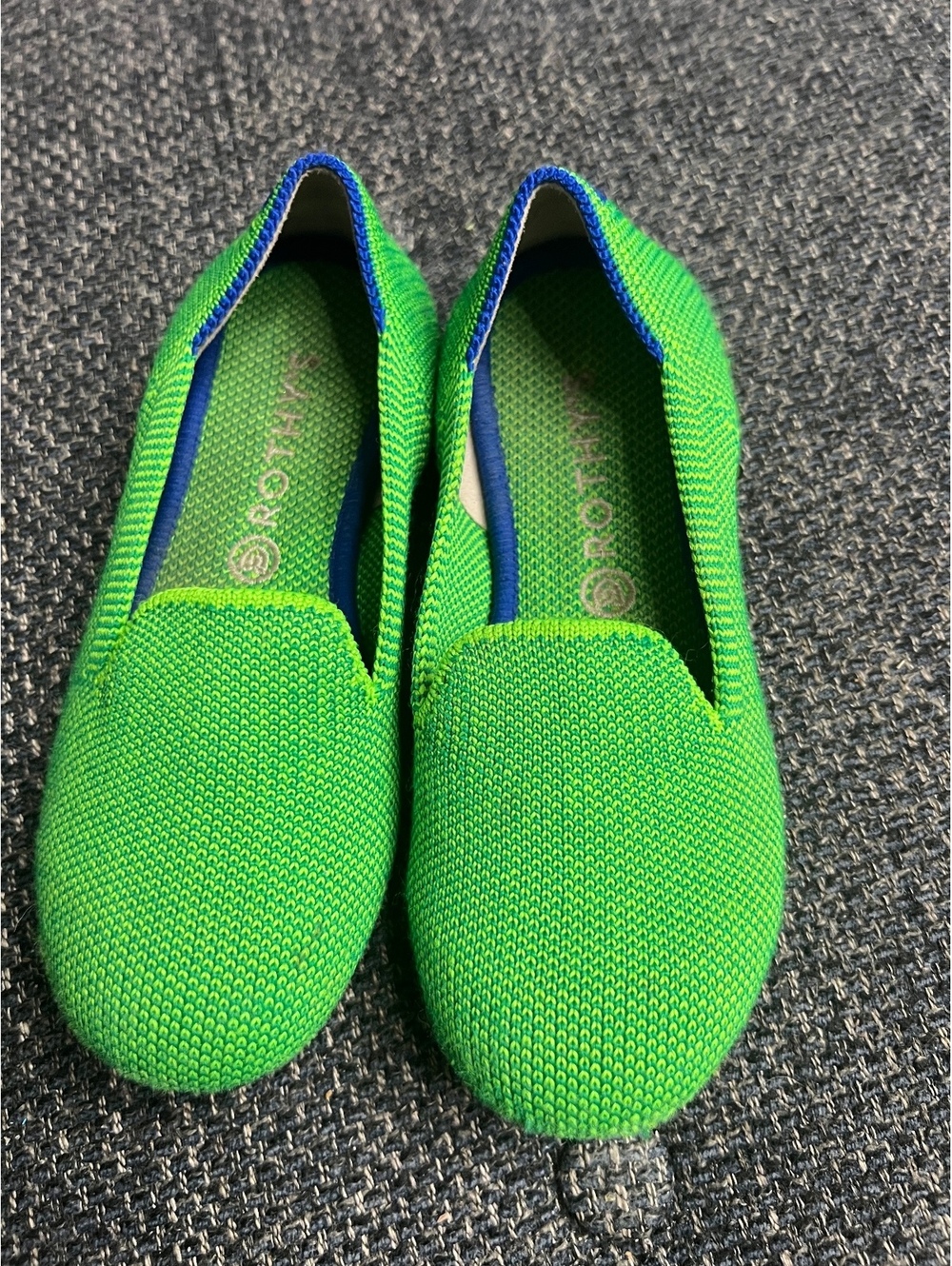 Rothy’s Bright Kelly green slip-on flats with blue trim
